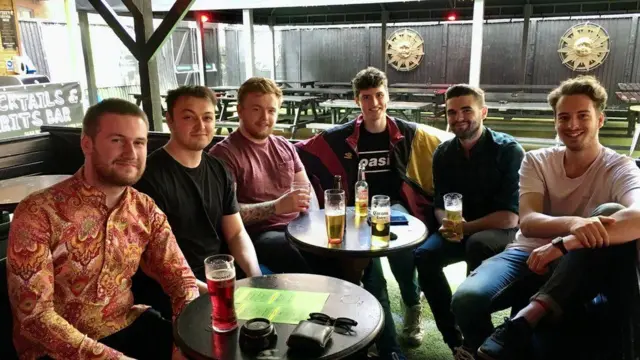 A group of friends at a bar in Manchester