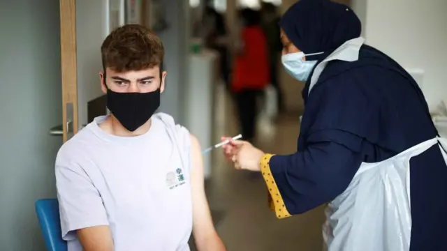 A man is injected with coronavirus vaccine