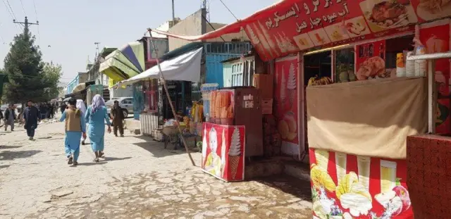 People walk in the streets of Kabul