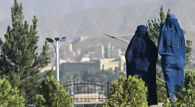 Two women wearing burqas