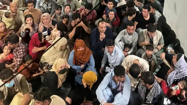 Afghan evacuees crowd the interior of a US Air Force C-17 Globemaster III transport aircraft departing Kabul, 15 August 2021