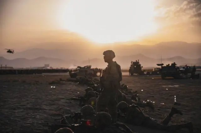 U.S. Army Soldiers assigned to the 10th Mountain Division stand security at Hamid Karzai International Airport