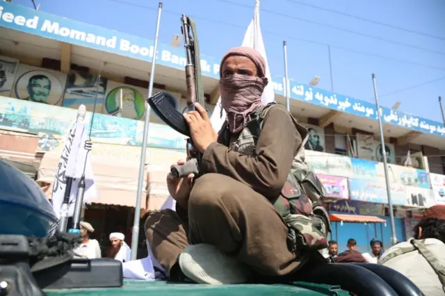 Taliban fighters patrol in Jalalabad