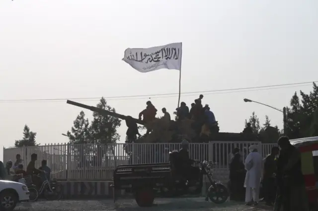 A Taliban flag flies in the city of Herat