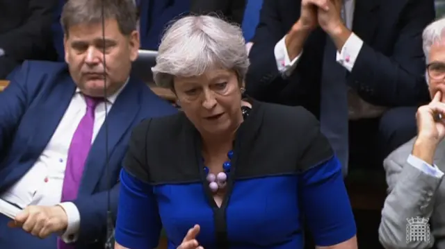 Theresa May speaks to Parliament