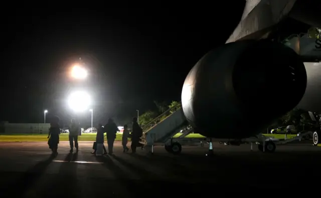 British nationals and Afghan evacuees depart a flight from Afghanistan at RAF Brize Norton.