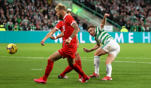 James Forrest's shot is deflected in