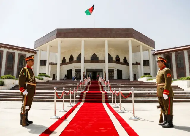 Afghan military honour guard wait outside parliament building before Afghan President Ashraf Ghani arrives at the parliament in Kabul, Afghanistan August 2, 2021