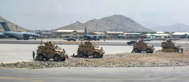 Security forces patrol Kabul's main airport