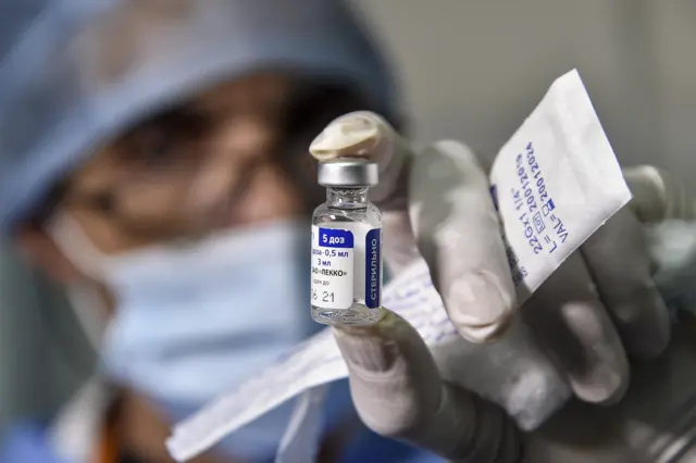 A medical worker holds a vial of Russia's Sputnik V vaccine for COVID-19 coronavirus disease at a clinic in the city of Blida, about 45 kilometres southwest of the Algerian capital, on January 30, 2021