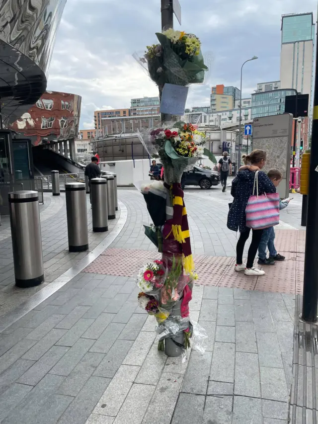 Tributes tied to a lamp post on Stephenson Street, Birmingham