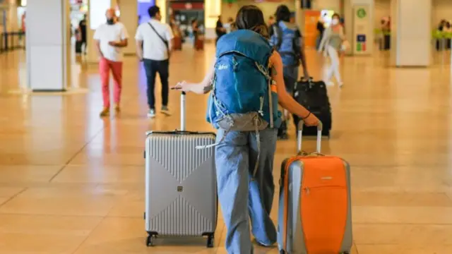 Passenger with suitcases