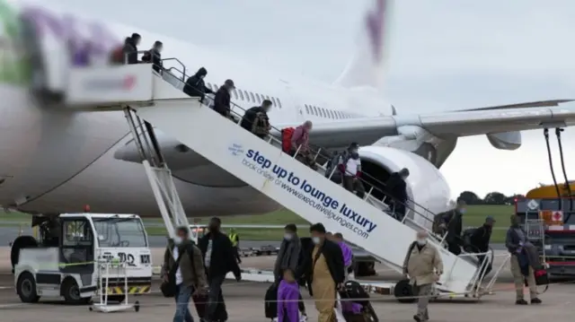 Refugees arriving at UK airport