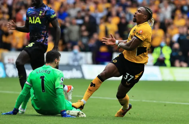 Hugo Lloris saves from Adama Traore