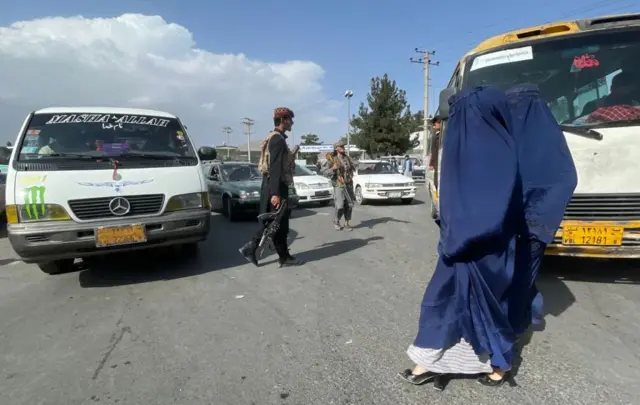 Taliban patrol the Afghan capital Kabul after taking over the control as daily life continues