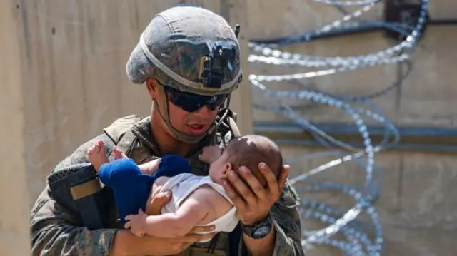 US soldier pictured with Afghan baby