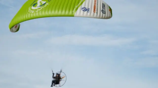 Sacha Dench flying in an electric paramotor