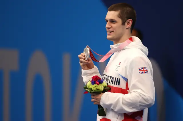 Reece Dunn of Britain celebrates winning the silver medal in the Men's 100m