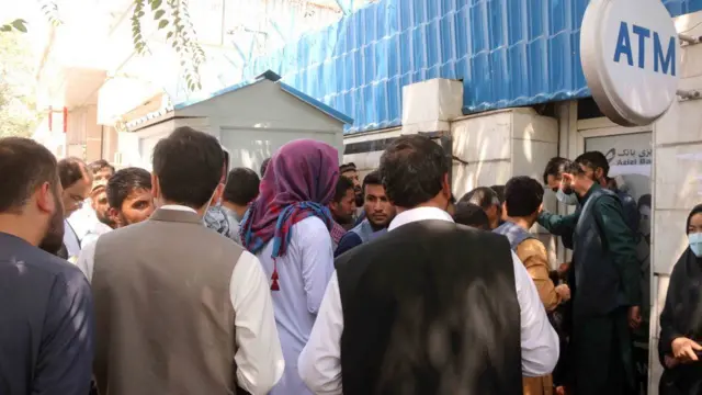 People seen lining up outside a bank