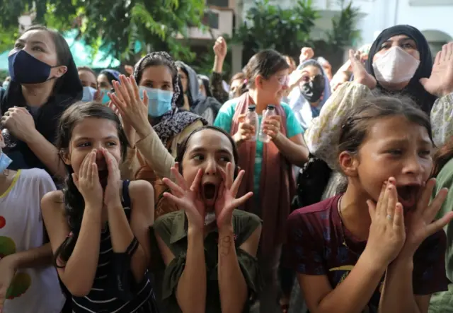 Afghan nationals protest outside the UN High Commissioner for Refugees' office in Delhi, India. Photo: 25 August 2021