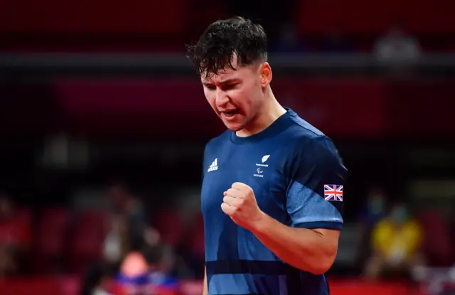 Ross Wilson of Great Britain celebrates after winning his C8 Group 3 Men's Singles Table Tennis Qualifying match