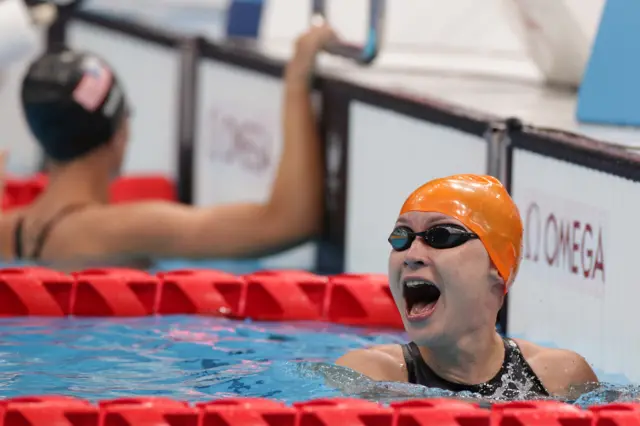 Yelyzaveta Mereshko of Team Ukraine celebrates winning gold in the Women's 50m Freestyle