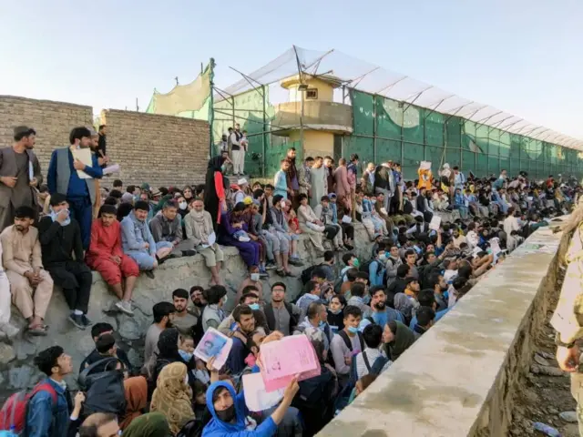 Crowds of people waiting outside Kabul airport