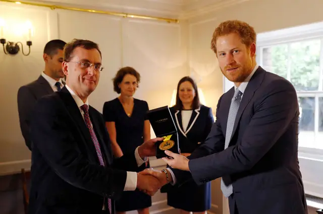 Prince Harry presents Elizabeth Marks' Invictus Games gold medal to Papworth Hospital