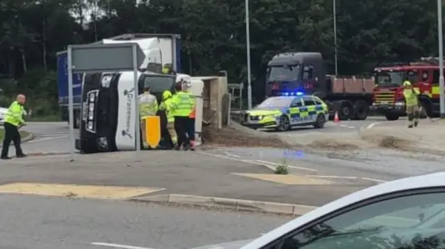 Overturned truck on Aeroplane Island A426 in Lutterworth, Leicestershire