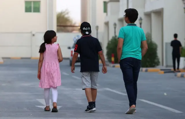 Afghan youths at a villa complex taking in refugees in Doha, Qatar, on 21 August 2021