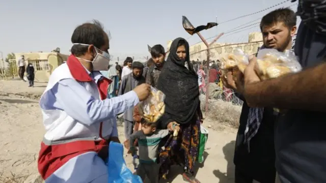 A handout photo made available by the Iranian Red Crescent shows Afghan refugees