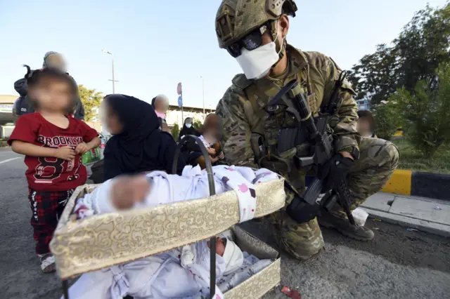 A South Korean soldier with a baby