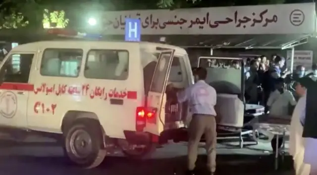 A screen grab shows an emergency vehicle as people arrive at a hospital after an attack at Kabul airport, in Kabul, Afghanistan August 26, 2021