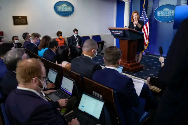 Jen Psaki speaks to reporters in the White House briefing room