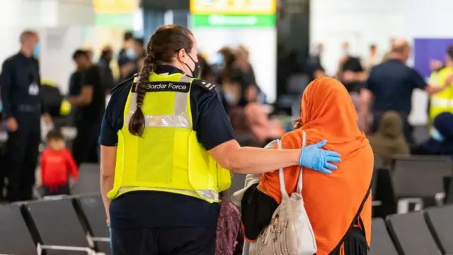 Afghan refugees arriving at Heathrow Airport