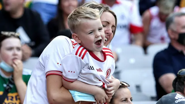 A young fan celebrates Tyrone's goal