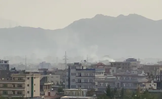 Smoke billows at the scene following an explosion near the Hamid Karzai International Airport in Kabul, Afghanistan