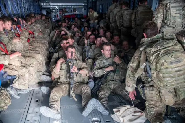 UK military personnel are seen onboard an A400M aircraft departing Kabul, Afghanistan August 28, 2021