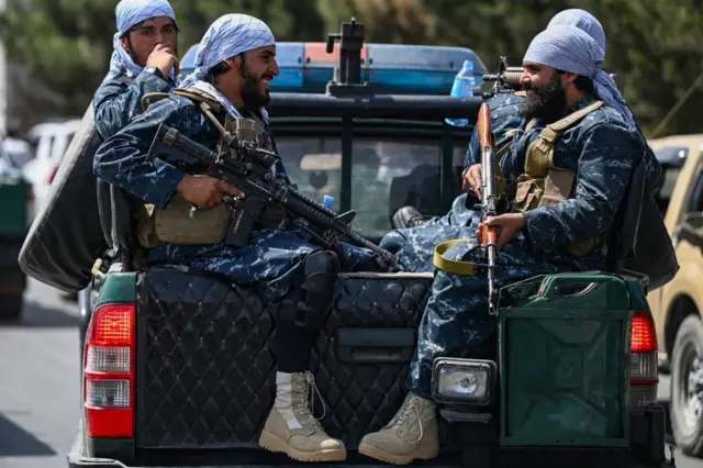 Taliban fighters patrol a street in Kabul on August 29, 2021