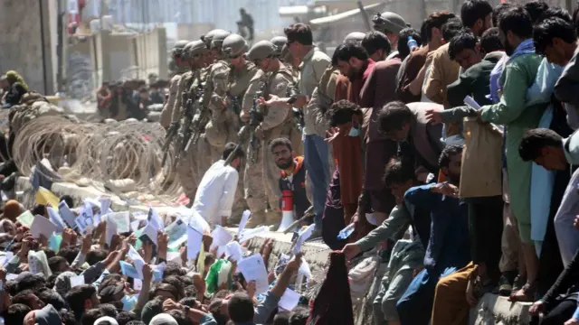 People at Kabul airport following the Taliban takeover