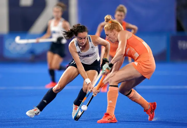 Fiona Crackles (left) and Netherland"s Margot van Geffen battle for the ball during the Women's Pool A match at Tokyo Olympic Games