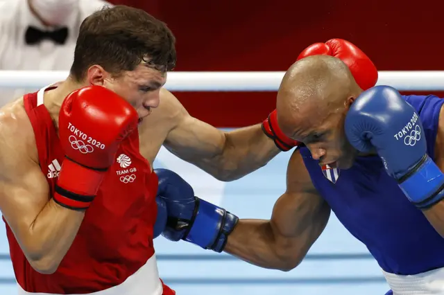 Pat McCormack (red) in action with Roniel Iglesias of Cuba (blue) in Men's Welter Final - Tokyo Olympic Games