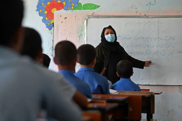 A teacher conducts a class at a government middle school in Kabul on August 30, 2021