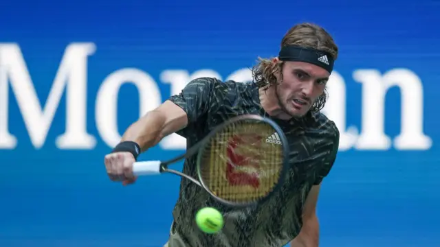 Stefanos Tsitsipas hits a backhand