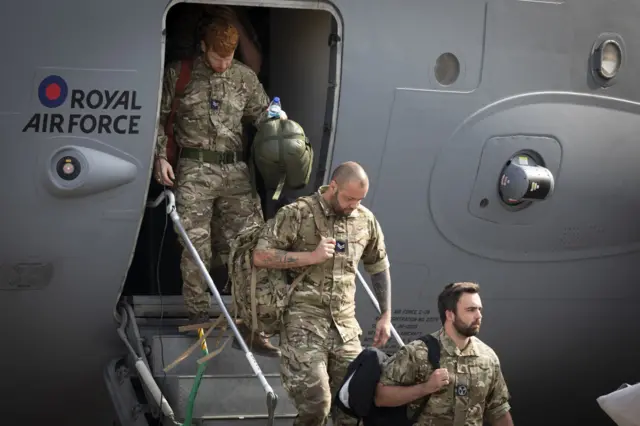 UK military personnel departing a flight from Afghanistan at RAF Brize Norton, Oxfordshire.