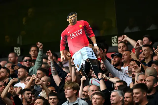 Man Utd fans hold cardboard cut-out of Cristiano Ronaldo