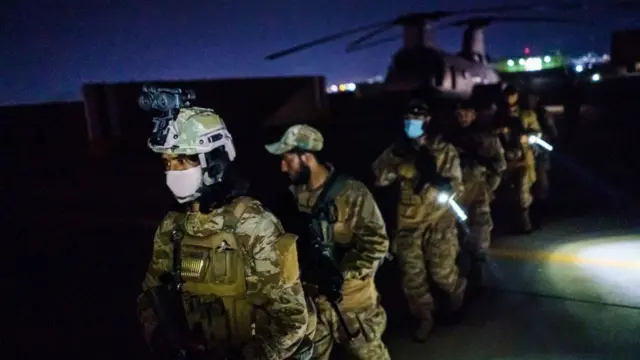 Taliban fighters, wielding American supplied weapons, equipment and uniforms, enter Kabul airport. Photo: 31 August 2021