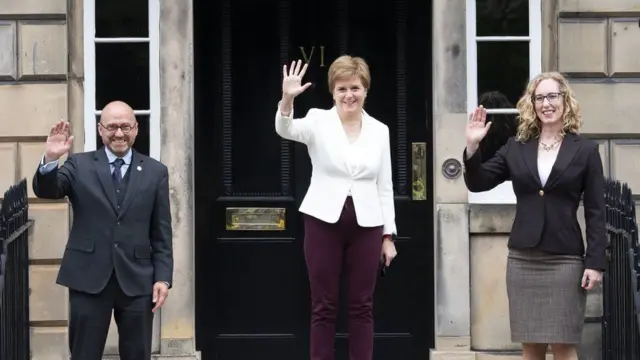 Patrick Harvie (left) and Lorna Slater (right) are joining the government of Nicola Sturgeon (centre)