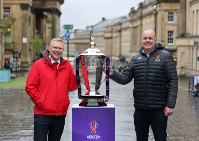 Newcastle Council leader Nick Forbes and Mick Hogan with the Rugby League World Cup in Newcastle