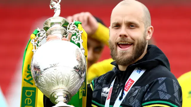 Teemu Pukki celebrates with the Championship trophy